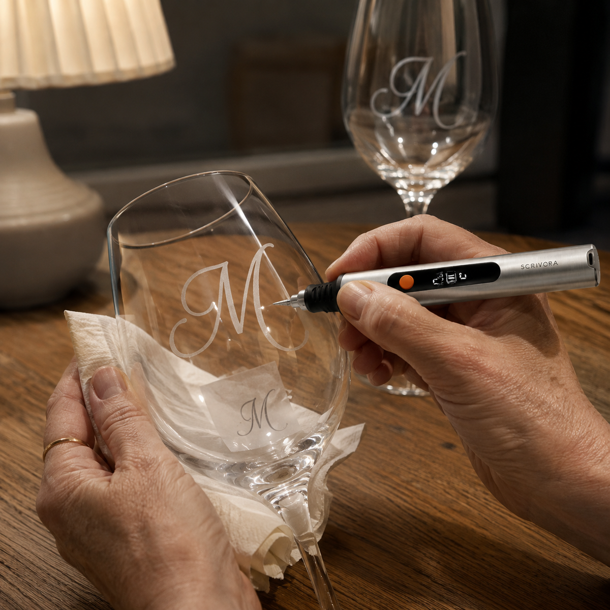 Mason jar under masking tape, printed name being traced